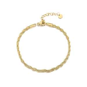 Armband liegt verdreht Gold Armband liegt verdreht Gold