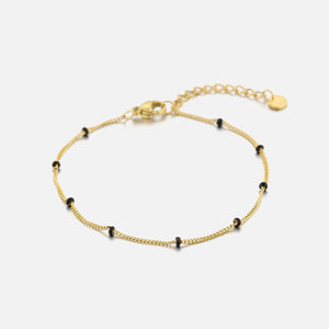 Goldarmband mit schwarzen Kugeln Goldarmband mit schwarzen Kugeln
