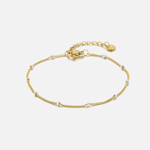 Goldarmband mit weißen Kugeln Goldarmband mit weißen Kugeln