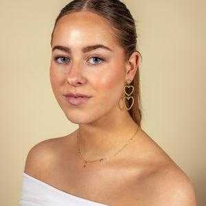 Hängende offene Goldherzen Hängende offene Goldherzen