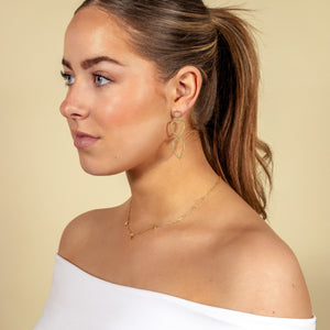 Hängende offene Goldherzen Hängende offene Goldherzen